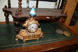 A VICTORIAN GILT METAL MANTLE CLOCK GARNITURE