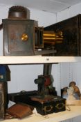 AN EARLY TIN PLATE MAGIC LANTERN WITH ORIGINAL BOX, A LATER LANTERN,VARIOUS SLIDES,ETC