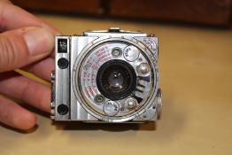 A JAEGER LE COULTRE COMPASS CAMERA WITH CUBITT ROLLBACK.