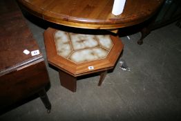 A TEAK AND TILE TOP COFFEE TABLE