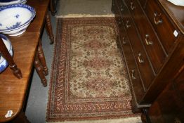A PERSIAN PATTERN SMALL RUG