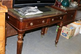 A VICTORIAN MAHOGANY TWO DRAWER WRITING TABLE