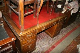 AN OAK PEDESTAL DESK