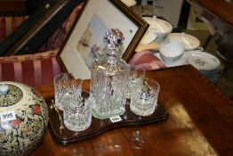 A DECANTER AND GLASSES SET ON TRAY