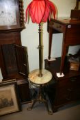 AN EDWARDIAN  BRASS ADJUSTABLE STANDARD LAMP