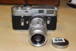 A LEICA M4 CAMERA SERIAL NUMBER 1177224 WITH ELMARIT 1:2.8/90 LENS SERIAL NUMBER 1685212.