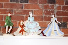 FOUR VARIOUS COALPORT FIGURES OF LADIES AND A ROYAL WORCESTER FIGURE OF A LADY.