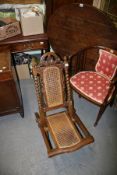 A VICTORIAN CANE SEAT FOLDING CHAIR