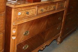 A CONTINENTAL WALNUT AND MAHOGANY CHEST OF DRAWERS