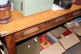 A LARGE OAK WRITING TABLE