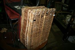 A WICKER LAUNDRY HAMPER