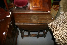 A SMALL ANTIQUE OAK DROP LEAF TABLE