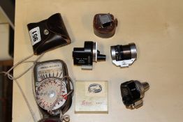 A LEITZ VIOOH UNIVERSAL VIEW FINDER SERIAL NUMBER 86624 TOGETHER WITH TWO FURTHER VIEW FINDERS, A