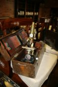 AN ANTIQUE BRASS MICROSCOPE BY HEARSON, LONDON IN MAHOGANY TRANSIT CASE