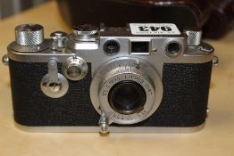 A LEICA IIIF CAMERA SERIAL NUMBER 824379 WITH LEATHER LEICA CASE.