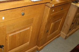 A PAIR OF OAK SIDE CBAINETS