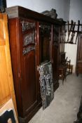 AN EDWARDIAN TRIPLE WARDROBE, MATCHING DRESSING TABLE AND BEDSIDE CABINET