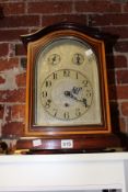 A GERMAN MAHOGANY AND INLAID BRACKET CLOCK WITH FOLIATE ENGRAVED SILVERED DIAL.