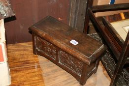 AN ANTIQUE CARVED OAK MINIATURE COFFER