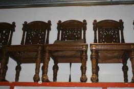 A SET OF CONTINENTAL CARVED OAK DINING CHAIRS