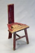 An early 19th Century Irish cock-fighting chair with remnants of period paint.