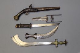 A Katar, together with a Jambiya, a brass hilted Tulwar with heavy curved blade, a worn Wakizashi