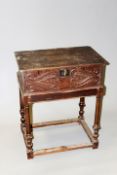An 18th Century oak bible box, the rising chip carved lid above carved front, on 19th Century