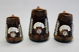 A large 19th Century set of three graduated bargeware jugs, “Mrs Berry from Willliam 1888”, each jug