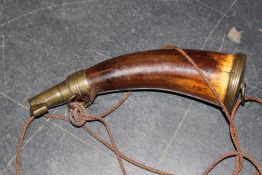 An early brass mounted powder horn, the interesting brass spout with swivel safety mechanism and