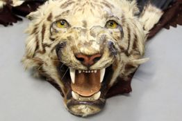A late 19th/early 20th Century tiger skin, with full head mount and lined, approx. 165cm to base