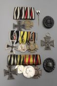 Three First World War German medal groups, comprising, a group of three, a group of four, a pair,
