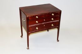 A George III style mahogany small chest of two short and two long drawers on tapering legs and pad