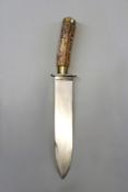 A large Bowie knife, 24cm heavy blade with spear point and additionally sharpened along 8.5cm of the