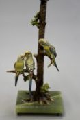 An Austrian cold painted bronze lamp base of three perching budgerigars, on onyx base, 36cm high