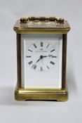 A 20th Century brass cased carriage clock, with Swiss movement signed Matthew Norman.