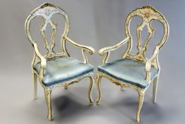 A pair of Italianate Rococo style armchairs with floral painted decoration on cabriole legs. (2)
