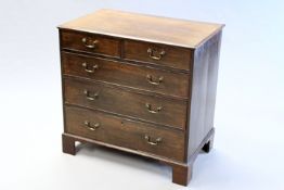 A George III and later mahogany small chest with two aligned short drawers above three graduated