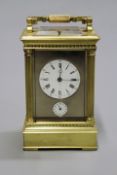A French repeater alarm carriage clock with lever platform striking on a gong, white enamel dial