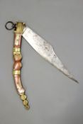 A Spanish Navajas, of large form, the blade with traces of etched decoration, the grip of