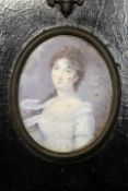 A 19th Century watercolour portrait miniature of a young woman in white dress, inscribed