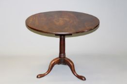 An 18th Century mahogany bird cage tilt top tripod table, 87cm diameter.