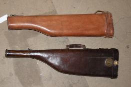 A brace of leather gun cases each of standard leg-o`-mutton configuration. (2)