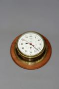 A Smith’s astral bulkhead clock the eight inch dial with primary seconds and centred with hours,