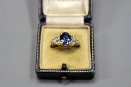 An 18ct gold sapphire and diamond set ring, (tested).
