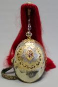 A reproduction Household Cavalry officer`s helmet, white metal skull with gilt and enamel helmet