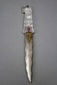 A rock crystal hilted Khanjar, later 18cm wavy damascus blade with yellow metal inlays, the hilt