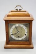 An Elliott chiming bracket clock in plain mahogany case with three train Westminster/Whittington