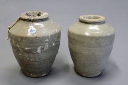 Two early celadon glazed Oriental ovoid jars, 19cm high. Provenance: Christie’s Wung Tau cargo.