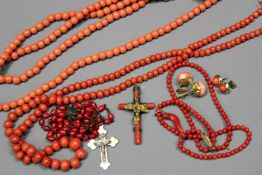 Two pink coral bead necklaces, a red coral rosary, and other items.