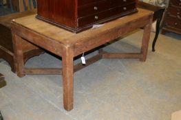 An early 20th Century Arts and Crafts style oak library table on square section legs united byY form